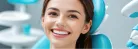 Smiling patient in a dental chair